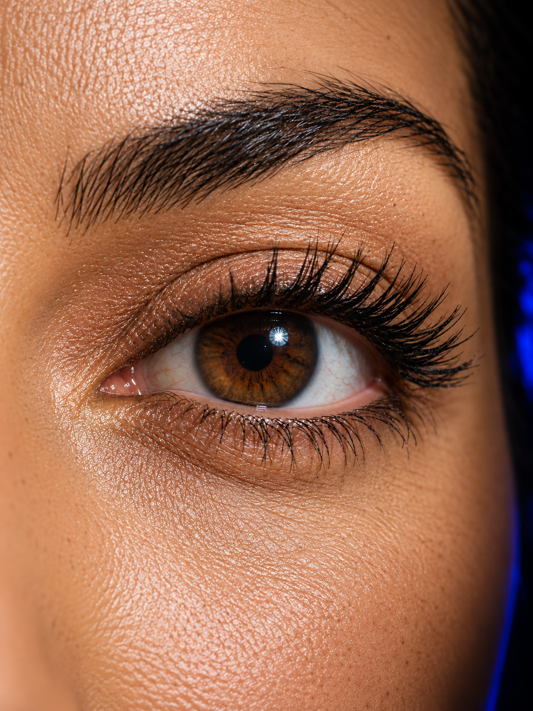 Close-up editorial eye makeup with defined individual lashes