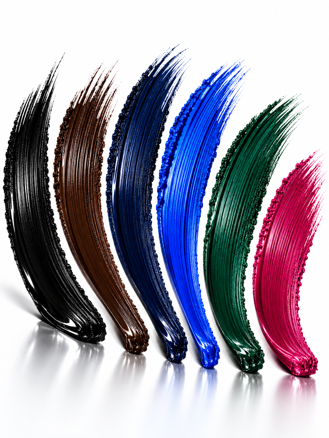 Six mascara pigment colors in an editorial studio composition