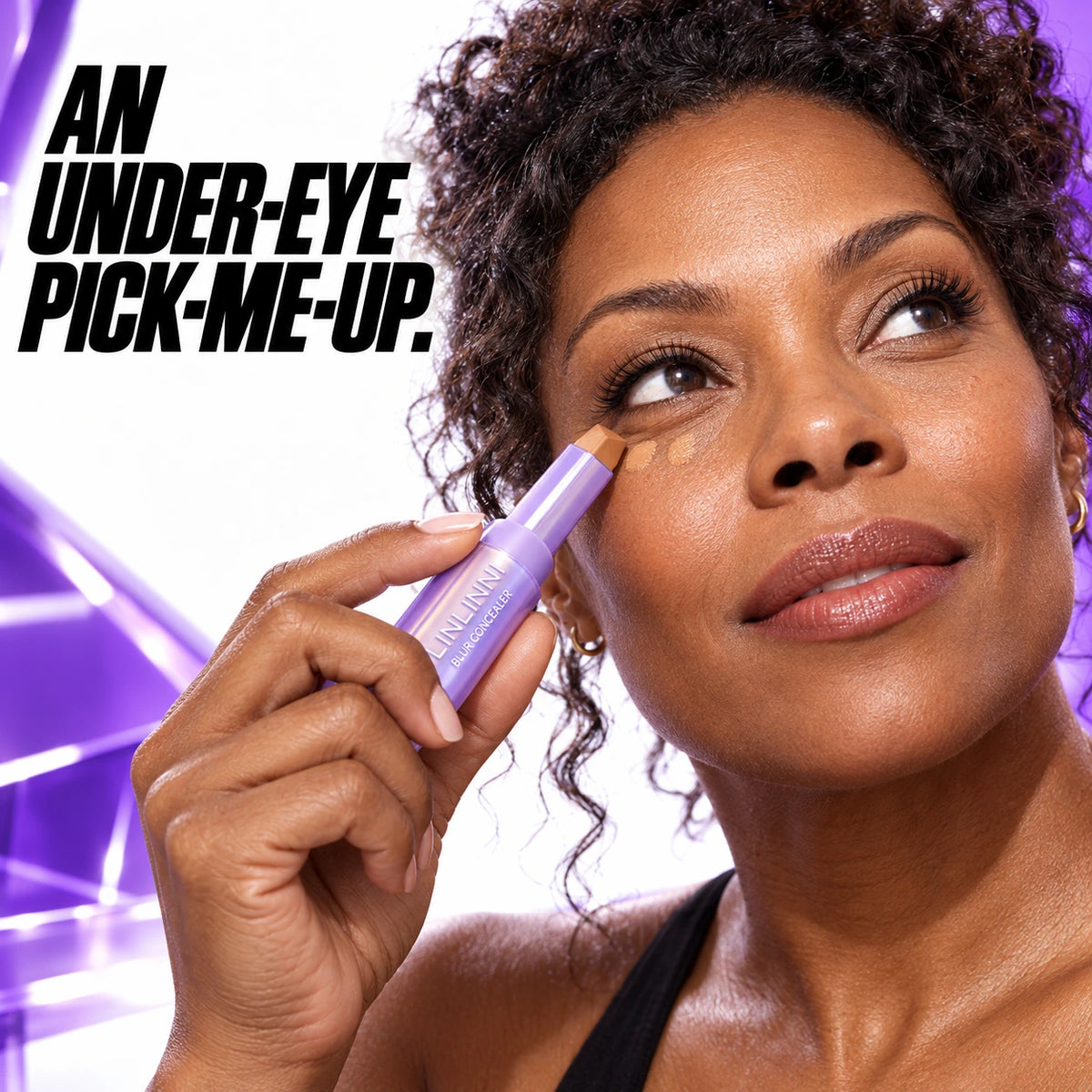 Gentle under-eye concealer application on an adult woman.
