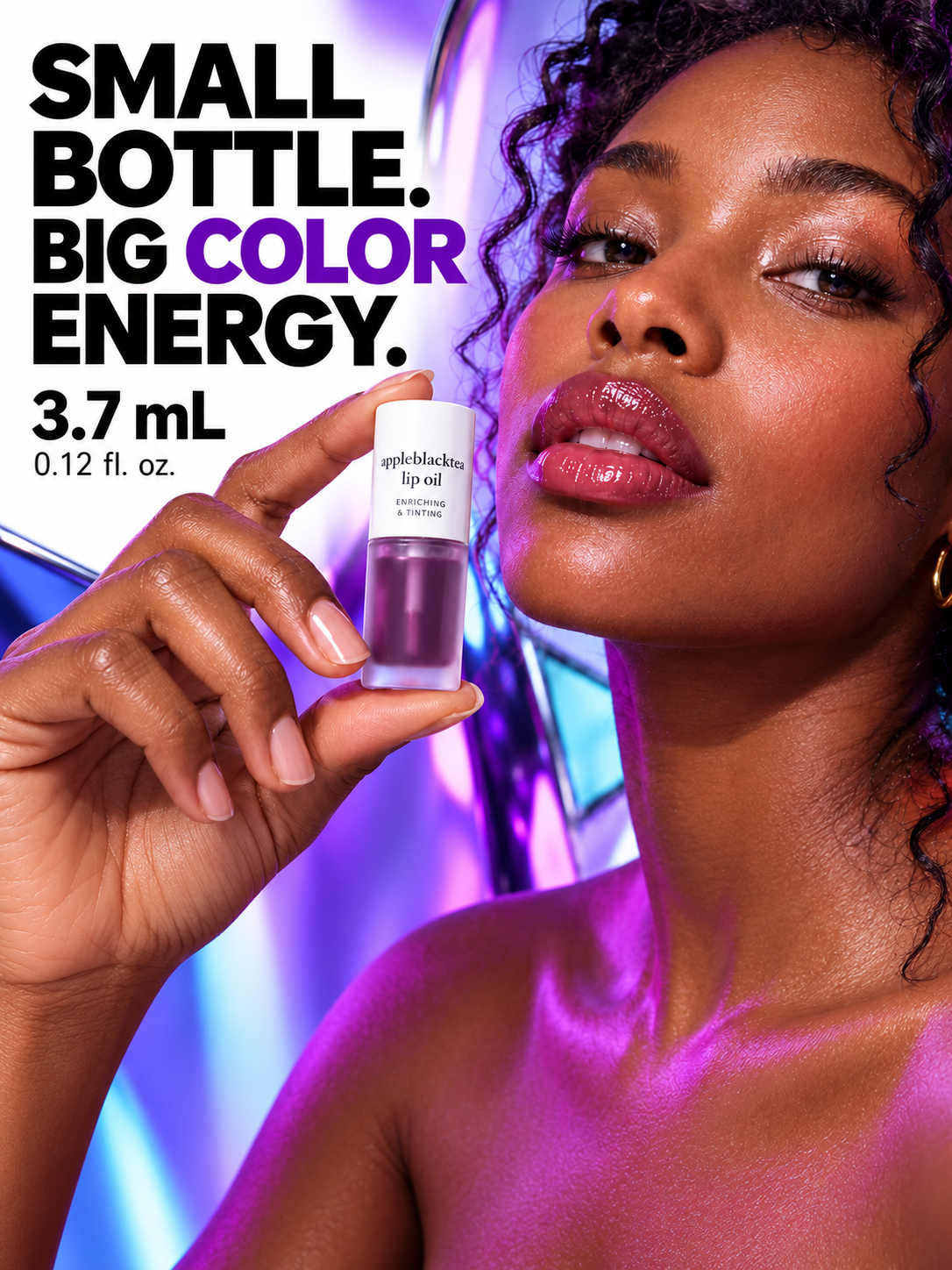 The 3.7 mL Appleblacktea Lip Oil bottle held in an adult hand.